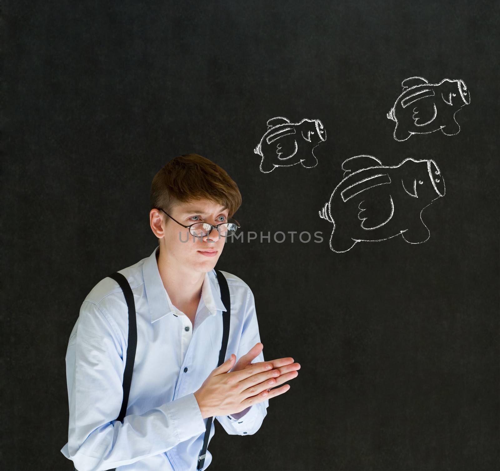 Businessman planning with flying money piggy banks in chalk on blackboard background