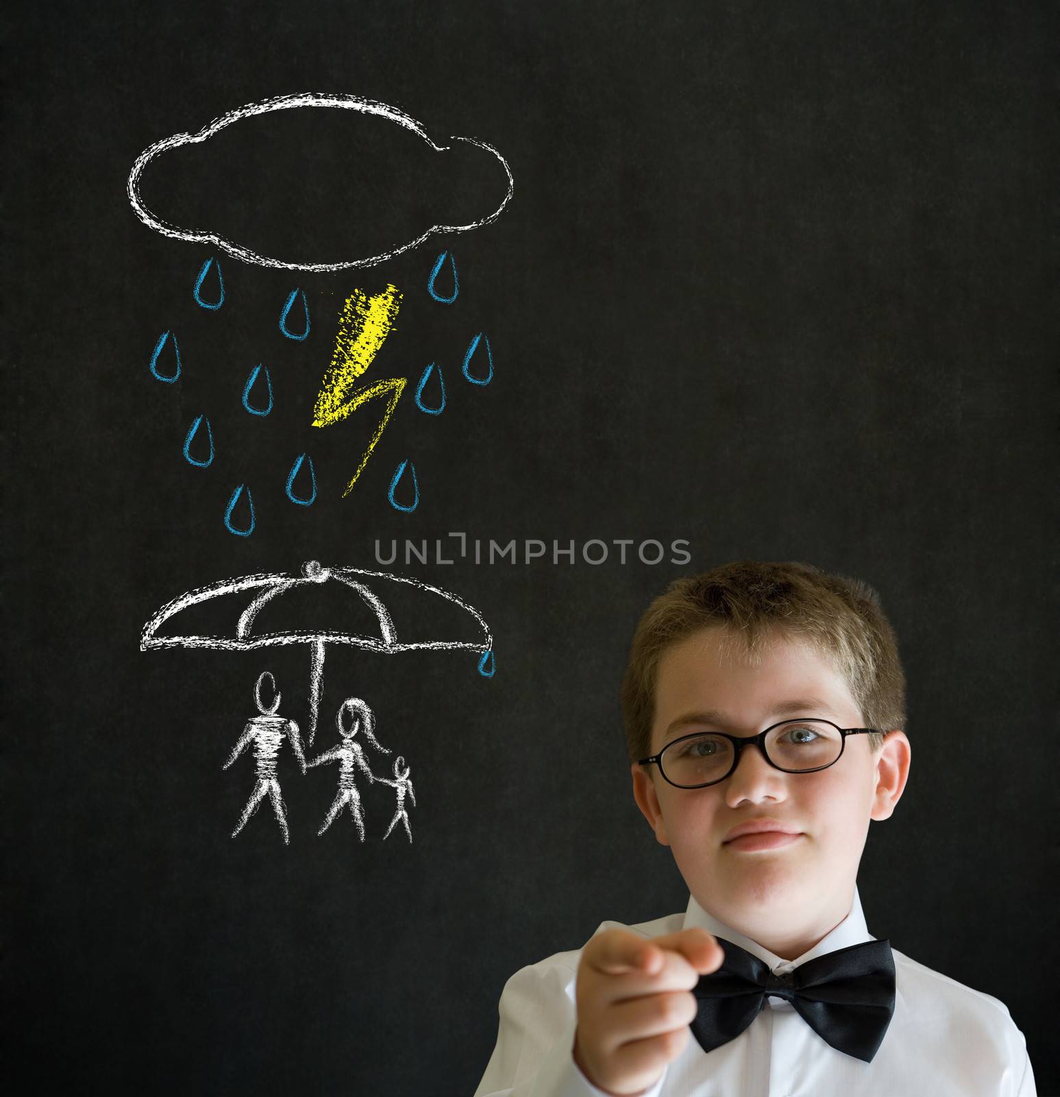 Thinking boy business man thinking about protecting family from natural disaster on blackboard background by alistaircotton