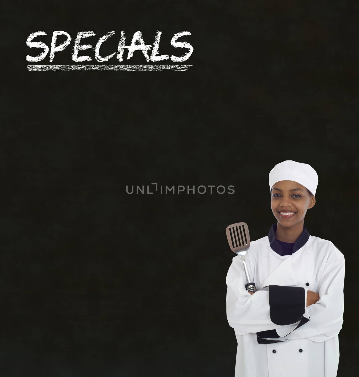 African American woman chef with chalk specials sign on blackboard background