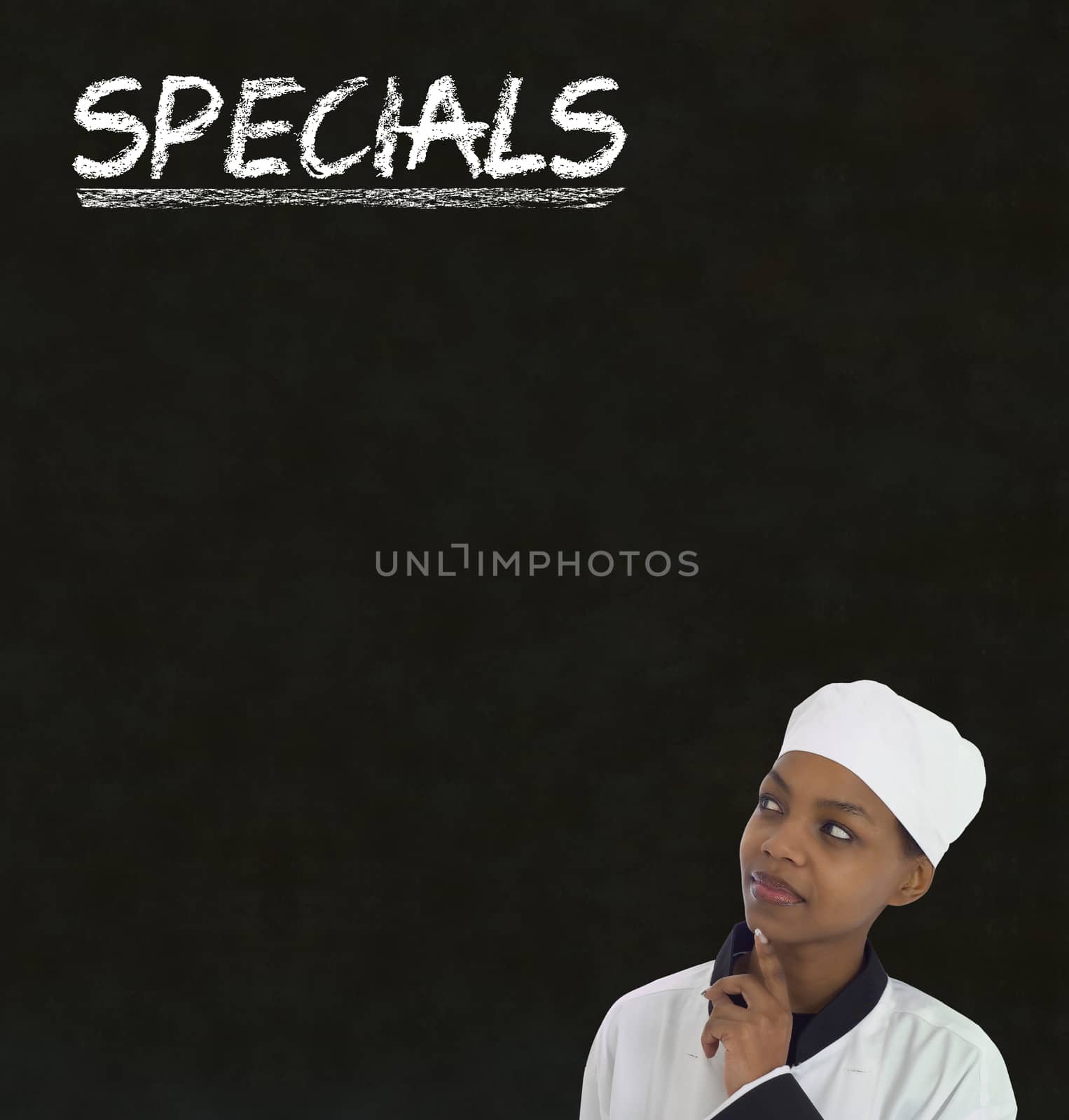 African American woman chef with chalk specials sign on blackboard background by alistaircotton