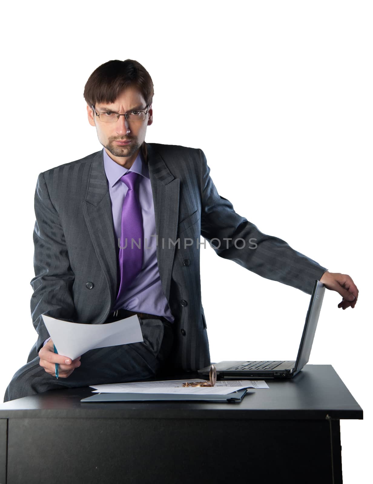 business man sitting on a desk with a laptop