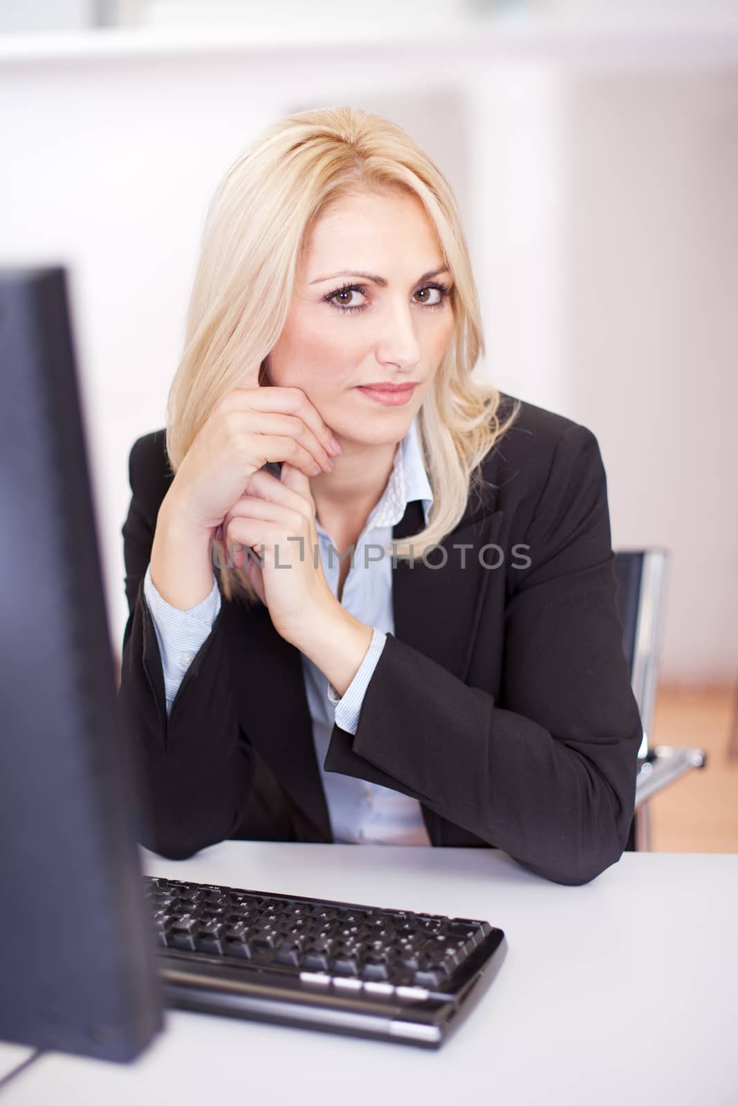 Beautiful businesswoman working on computer in the office