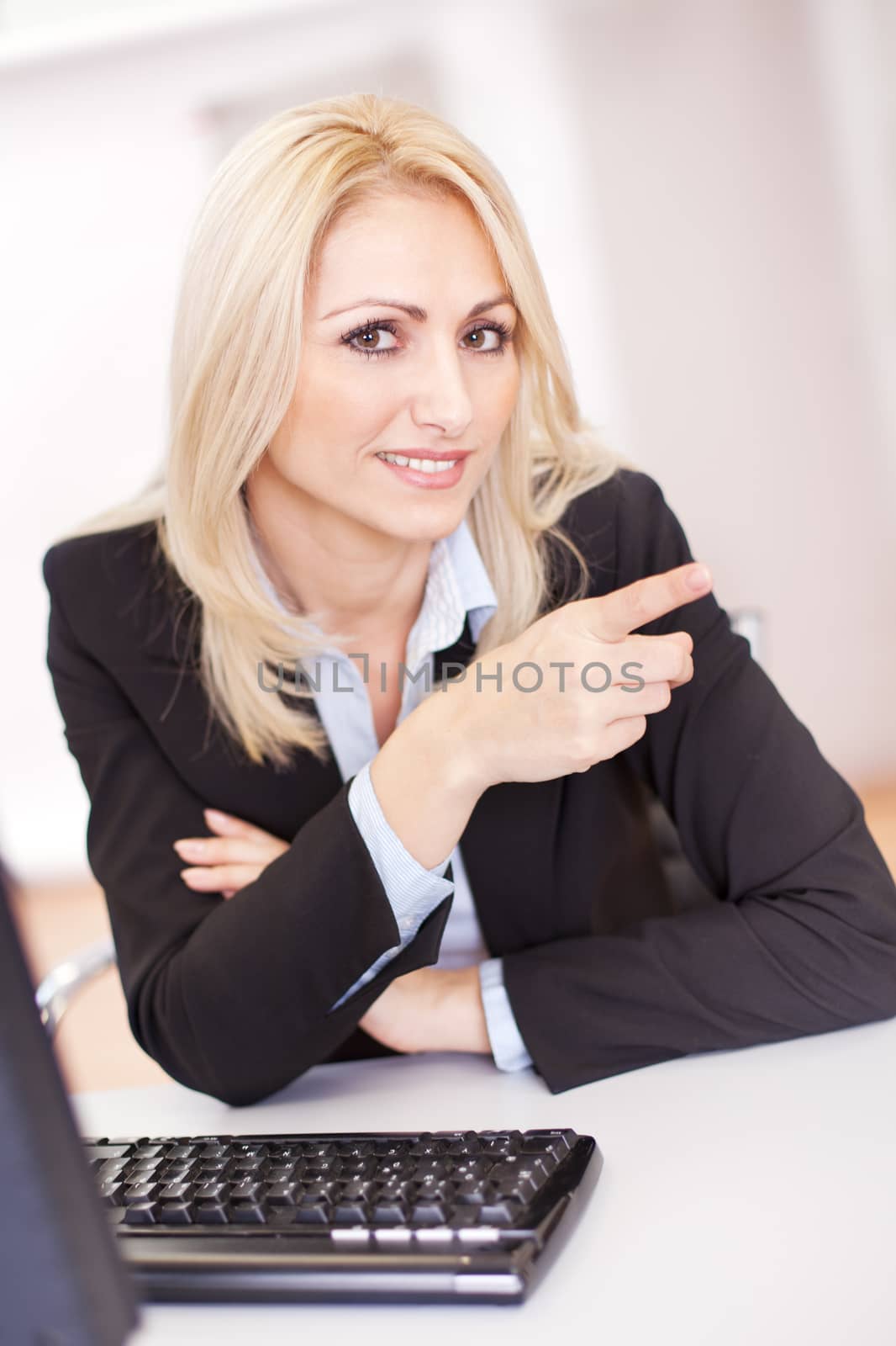 Beautiful businesswoman working on computer in the office