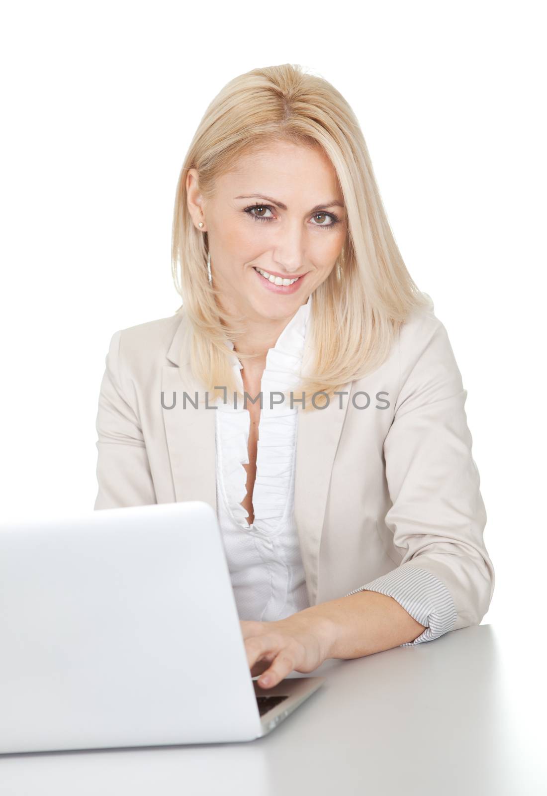 Beautiful businesswoman working on computer by AndreyPopov