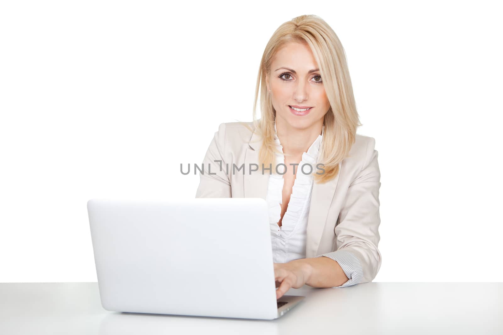 Beautiful businesswoman working on computer by AndreyPopov