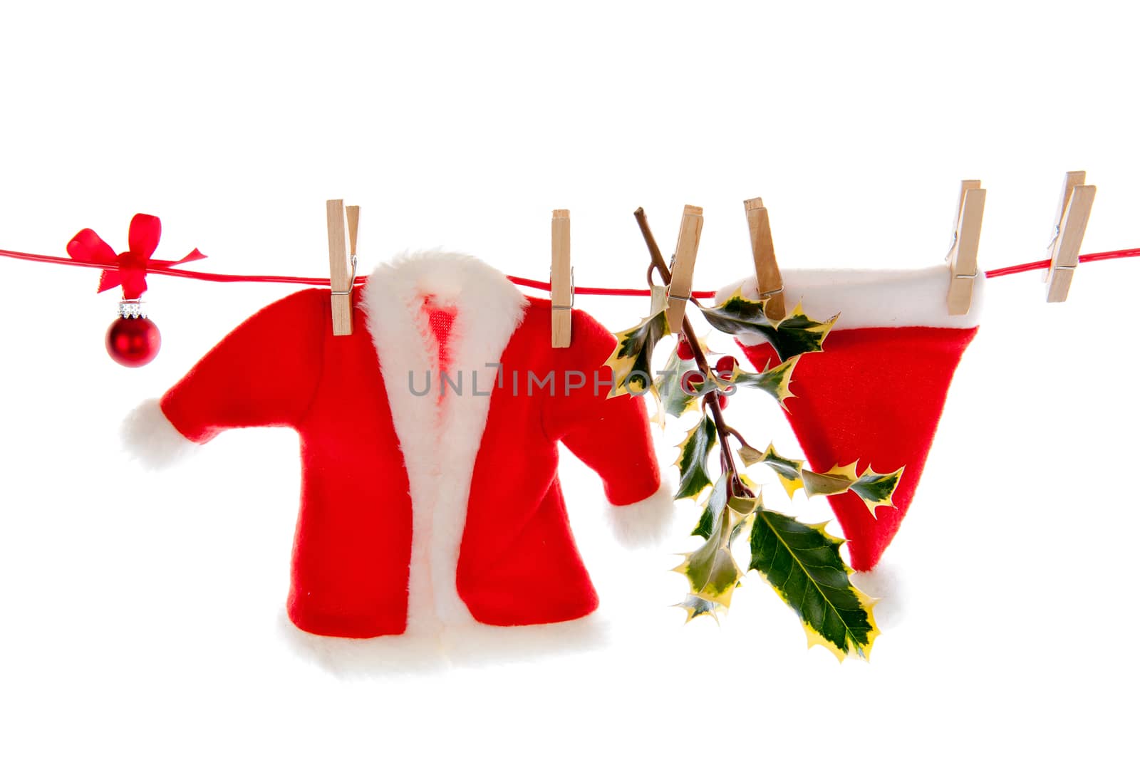 Santa's clothes are hanging on the clothesline on a white background