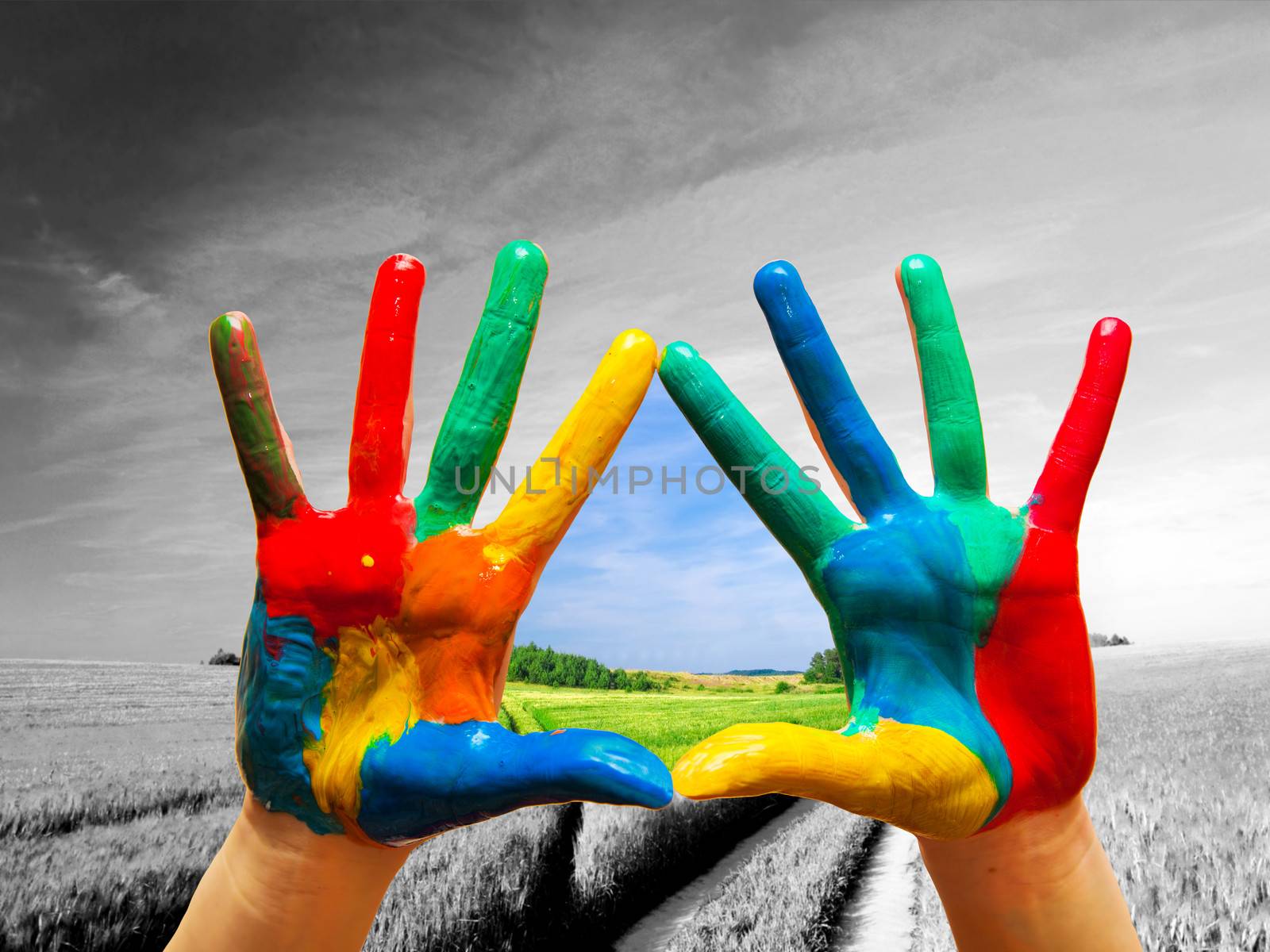 Painted colorful hands showing way to colorful happy life by photocreo
