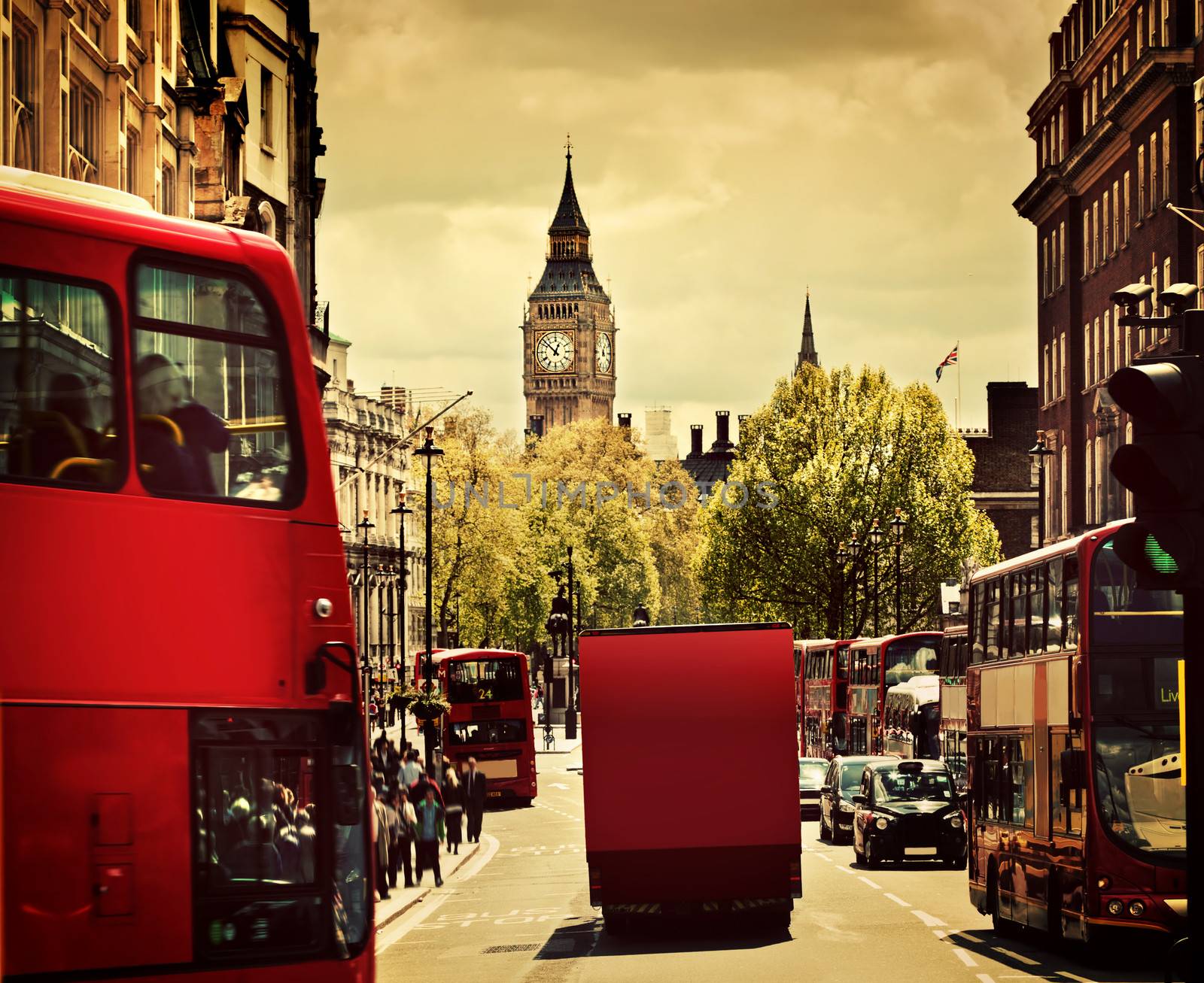 Busy street of London, England, the UK. Red buses, Big Ben by photocreo