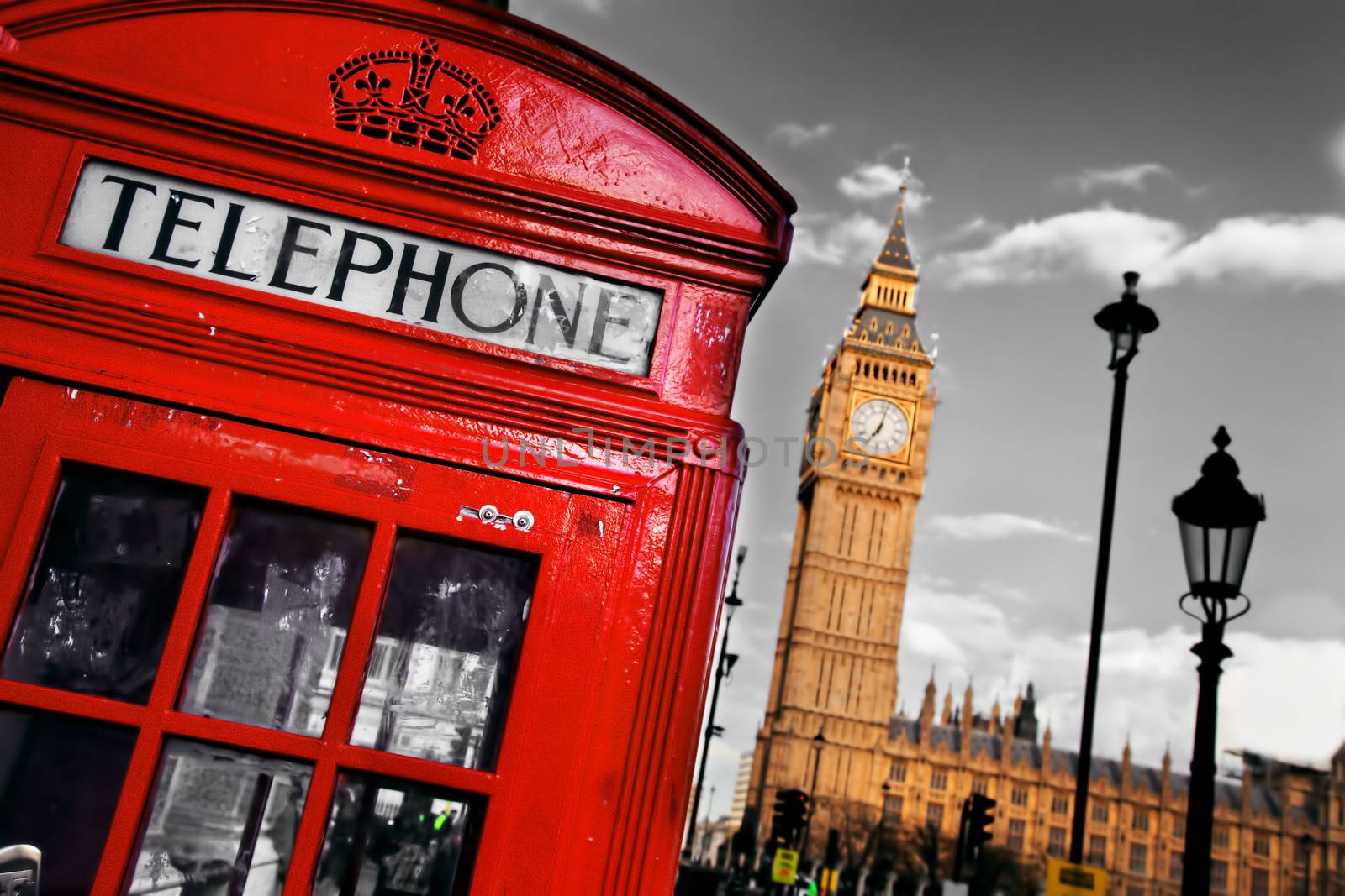Red telephone booth and Big Ben in London, England, the UK by photocreo