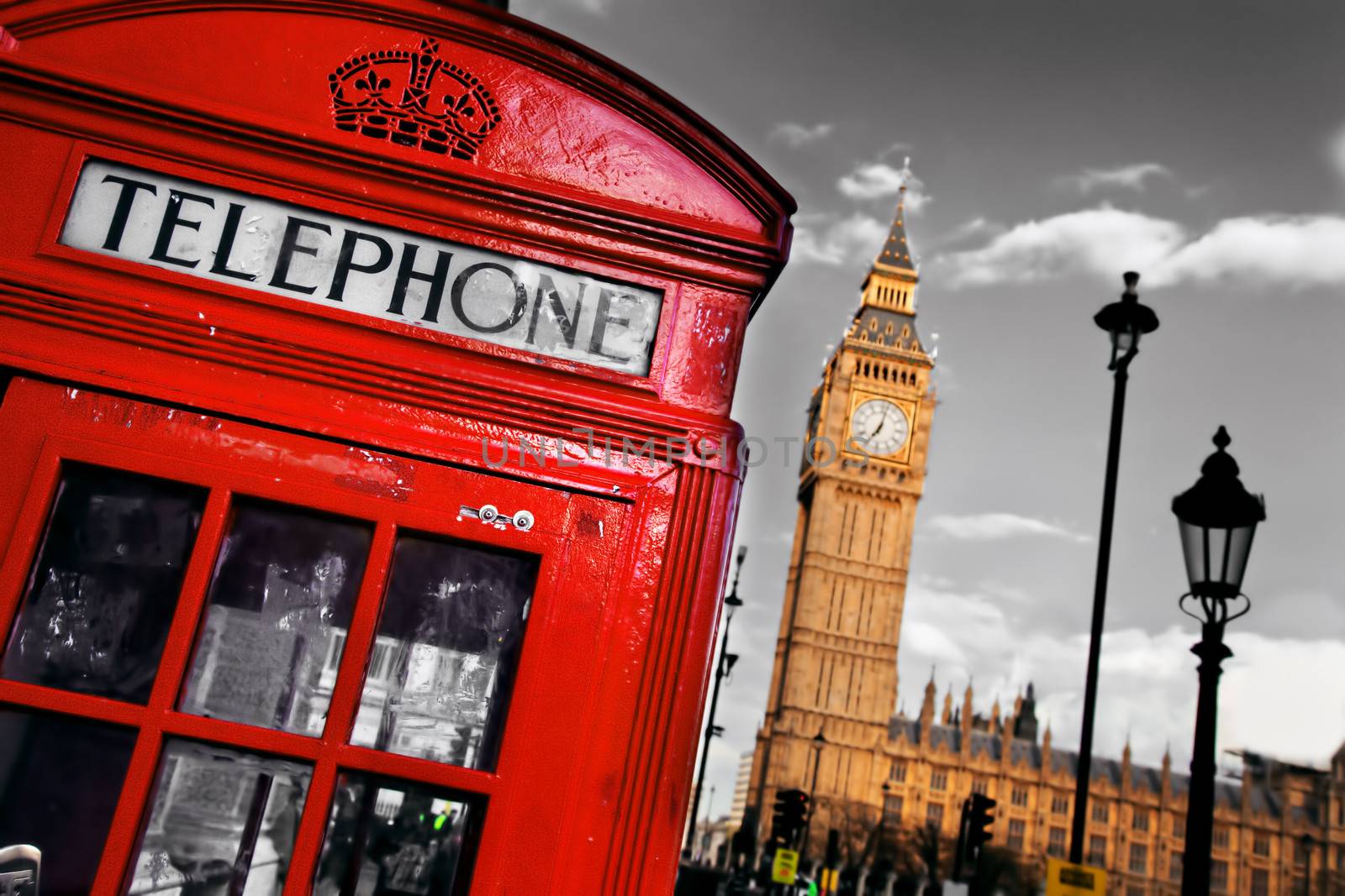 Red telephone booth and Big Ben in London, England, the UK. The symbols of London on black on white sky.