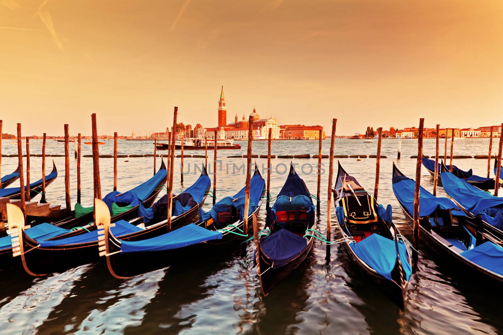 Venice, Italy. Gondolas on Grand Canal at sunset by photocreo
