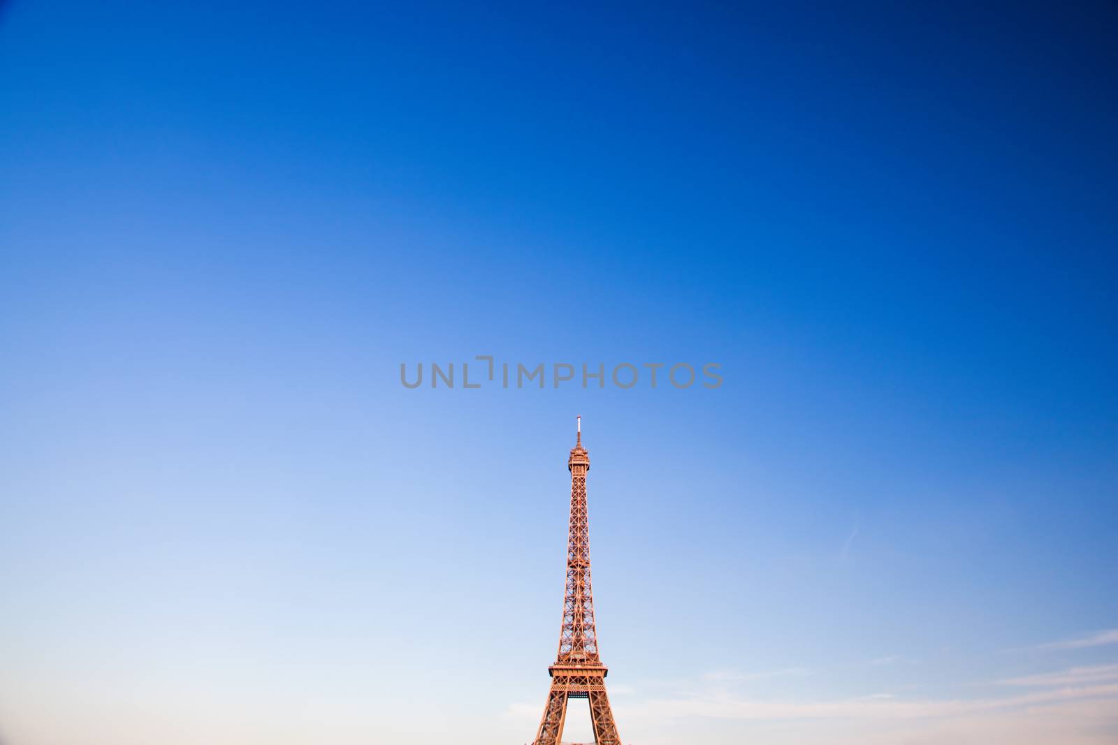 Eiffel Tower, the city in the background, sky copyspace. Paris, France