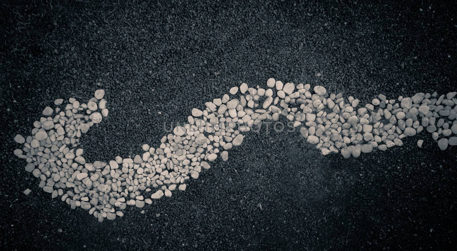 Pebbles stones arranged in an abstract. Black and white.