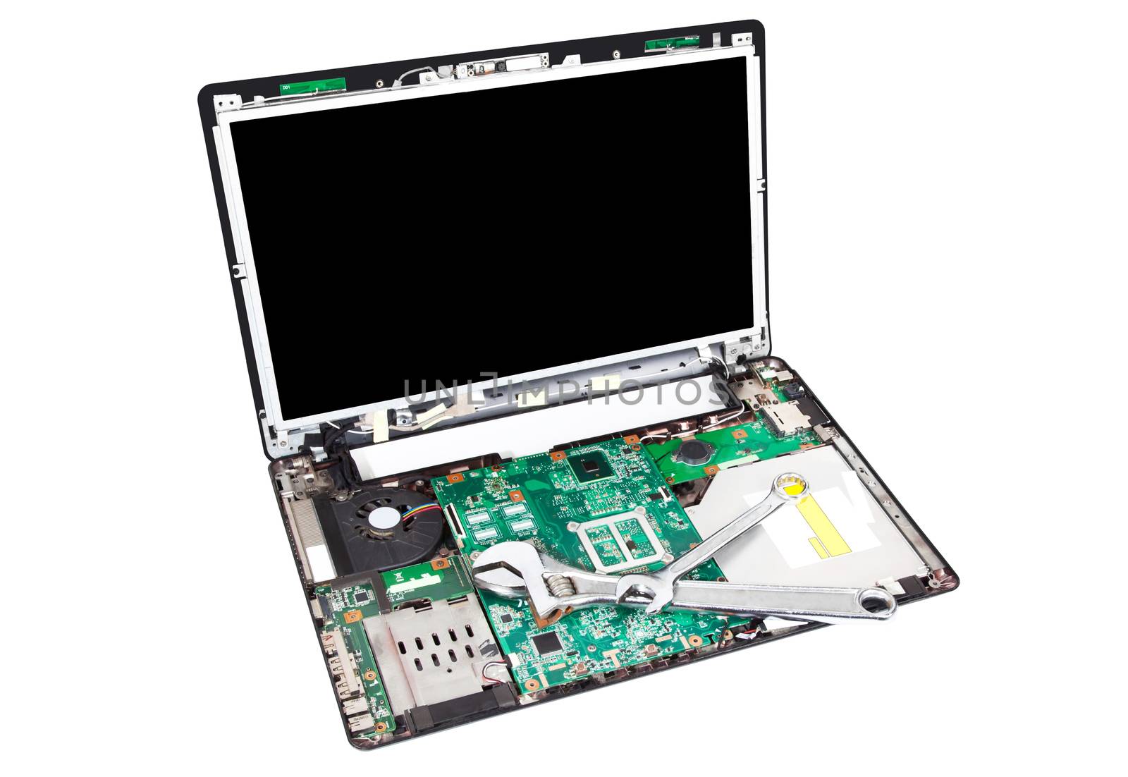 Laptop disassembled with wrench on it by RawGroup