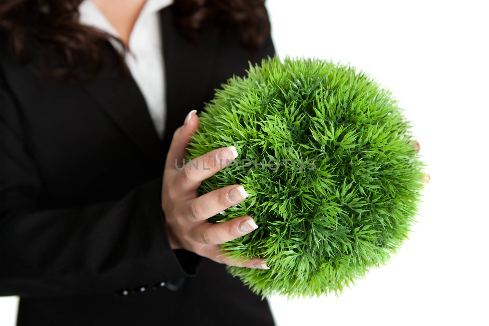 Holding green sphere - symbol of green planet. Isolated on white