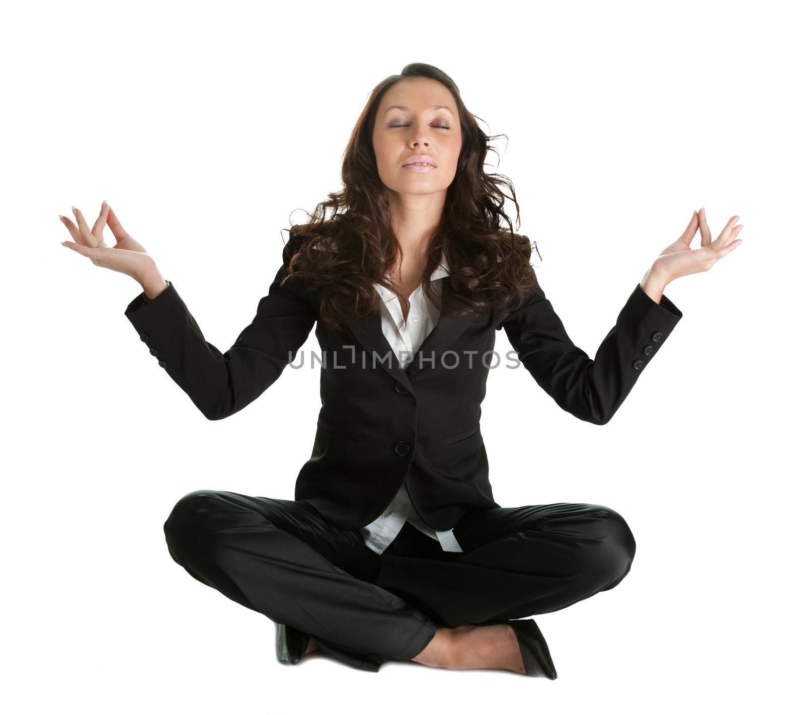 Businesswoman sitting in lotus flower position of yoga. Isolated on white