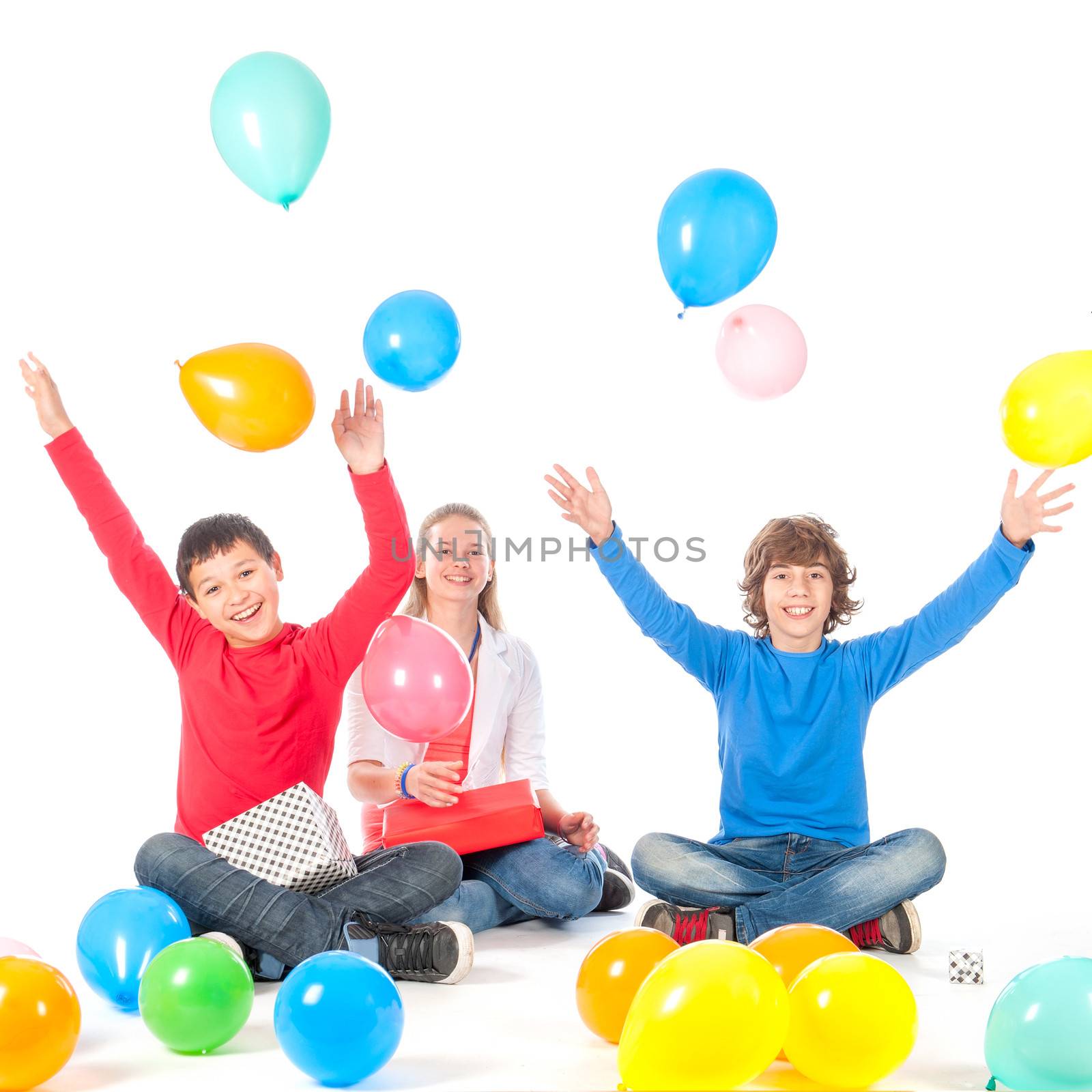Celebrating a birthday with presents and balloons on a white background
