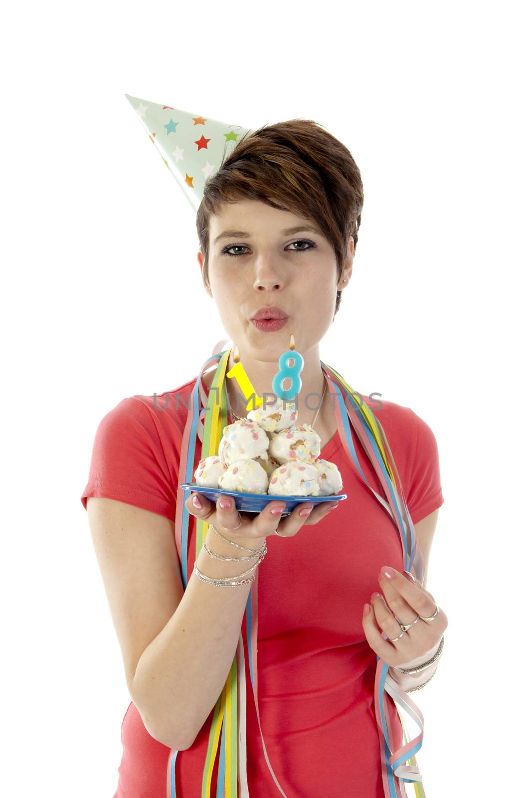 a birthday girl on her 18th birthday, holding a cake with a candle on a white background