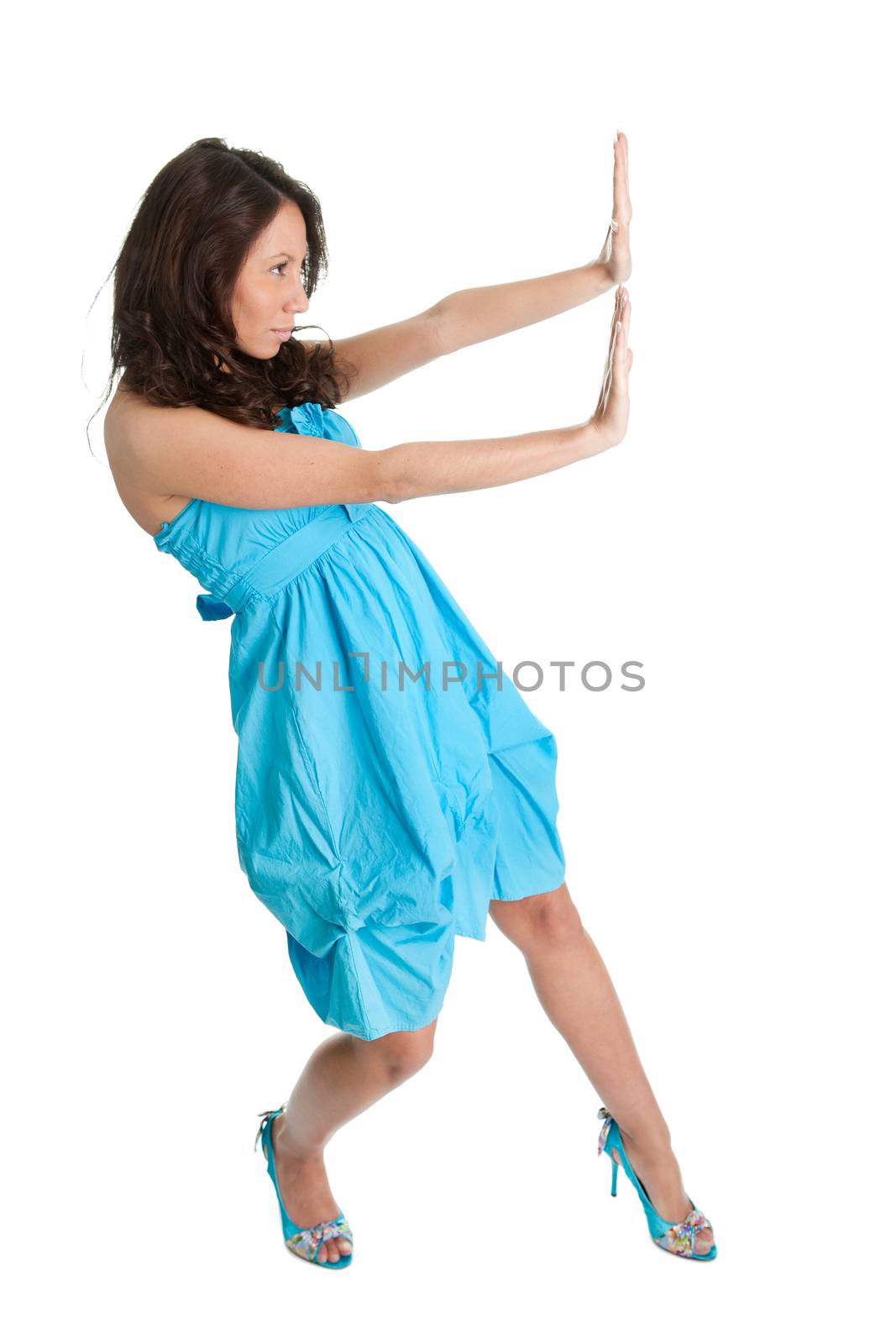 Young women in elegant dress pushing copyspace. Isolated on white