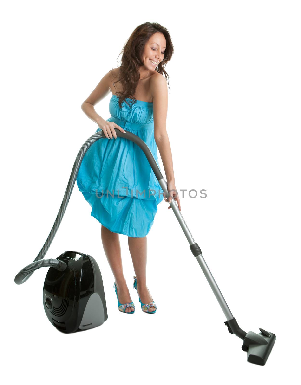 Cheerful woman with handheld vacuum cleaner. Isolated on white