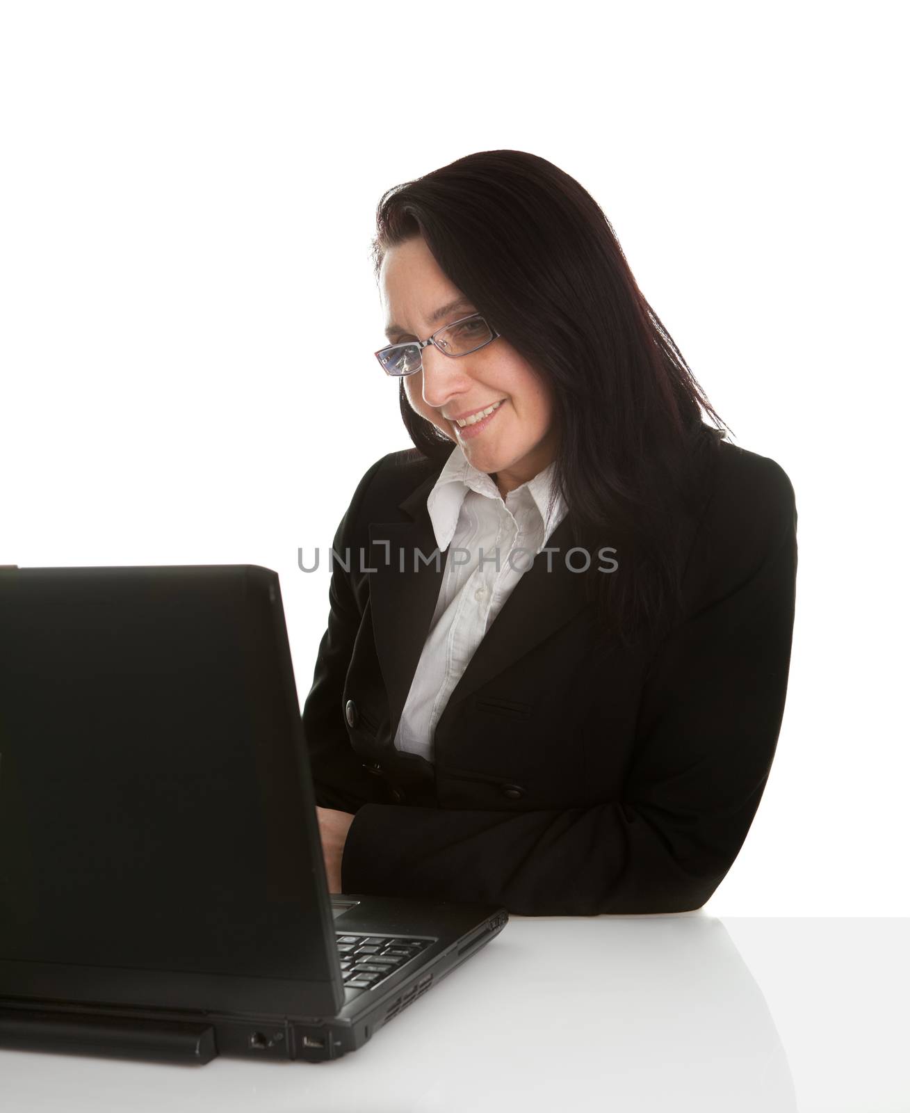 Beautiful business woman working on laptop. Isolated on white