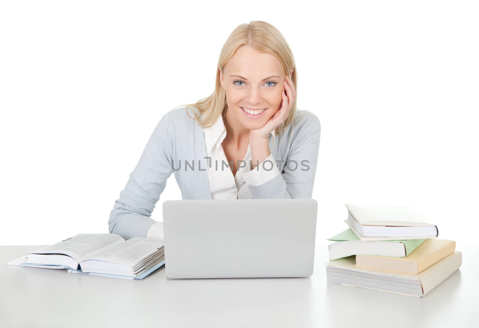 Beautiful student girl studying with laptop at the desk. Isolated on white
