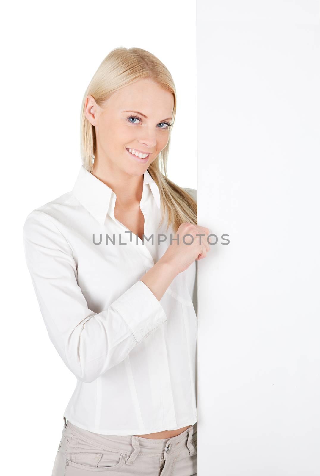 Cheerful businesswomen presenting empty board. Isolated on white