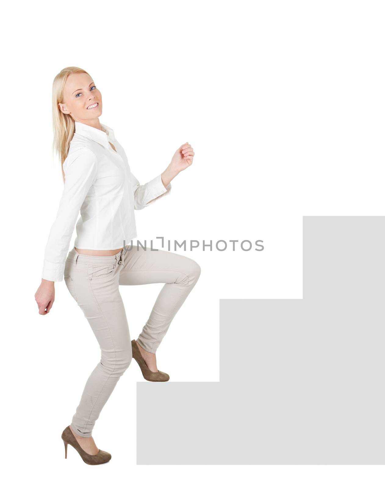 Successful businesswoman walking up a staircase. Isolated on white