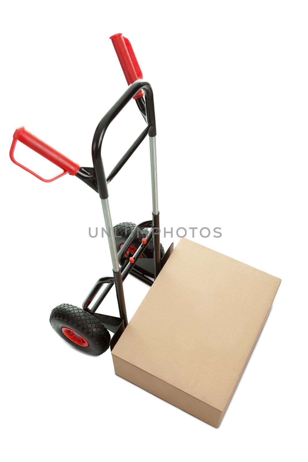 Brown cardboard box on hand truck isolated over white background