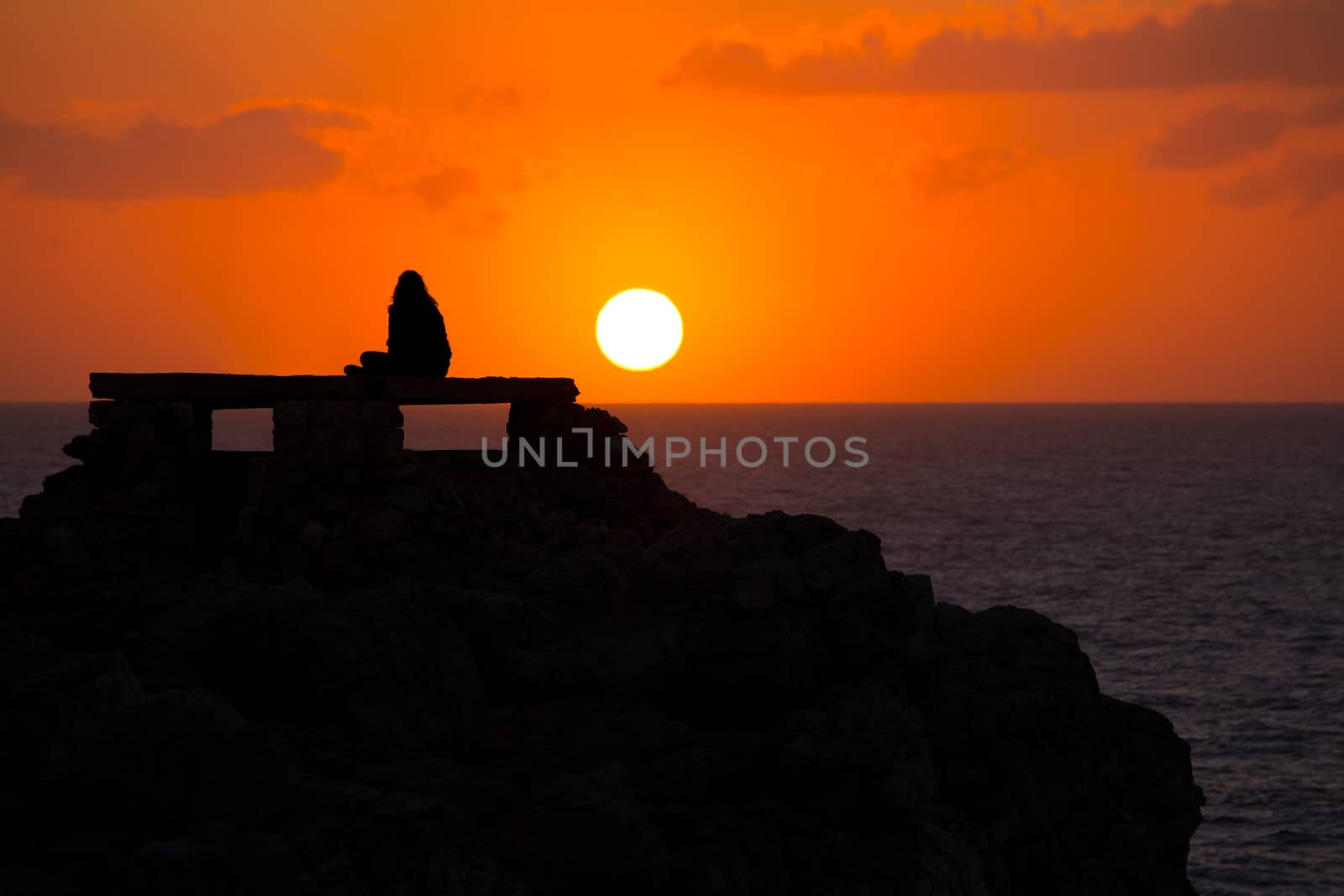 Ciutadella Menorca at Punta Nati sunset with girl by lunamarina