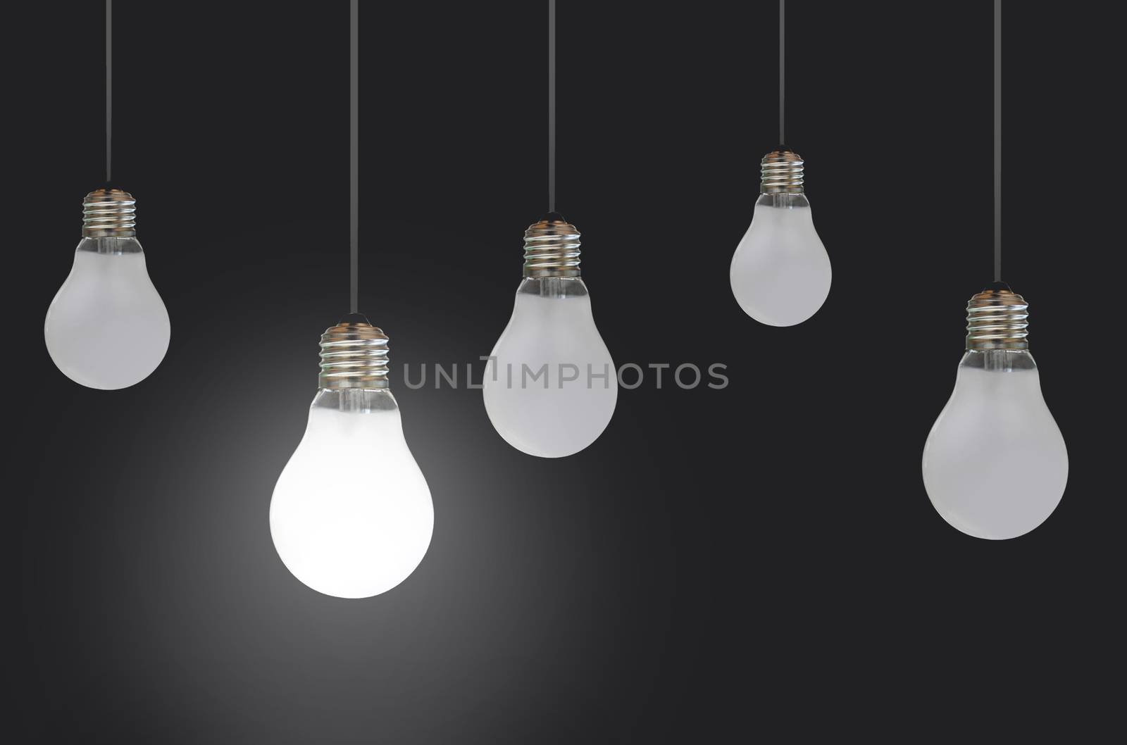 Hanging light bulbs with one lit