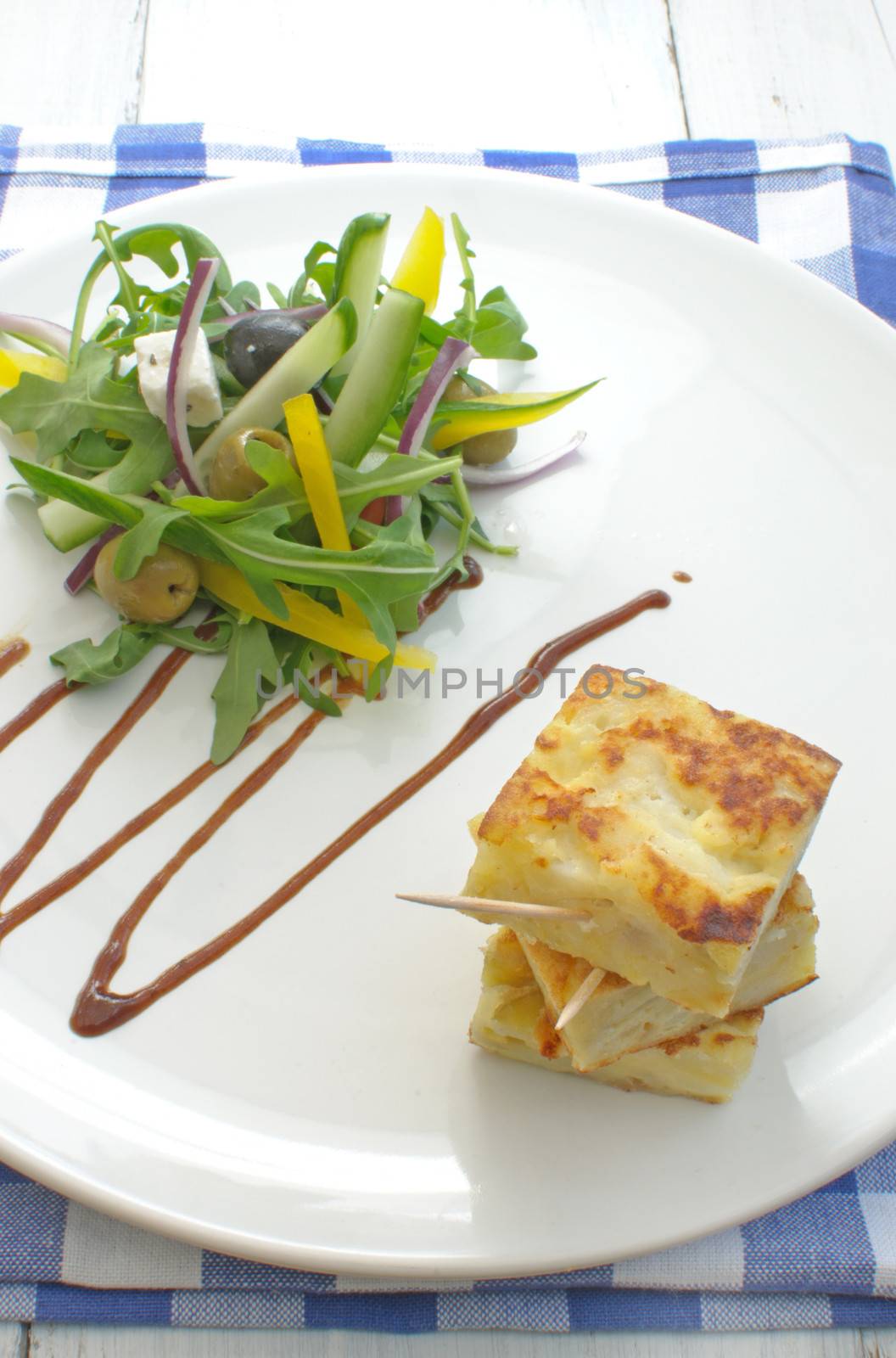 Spanish omelette with salad  by unikpix