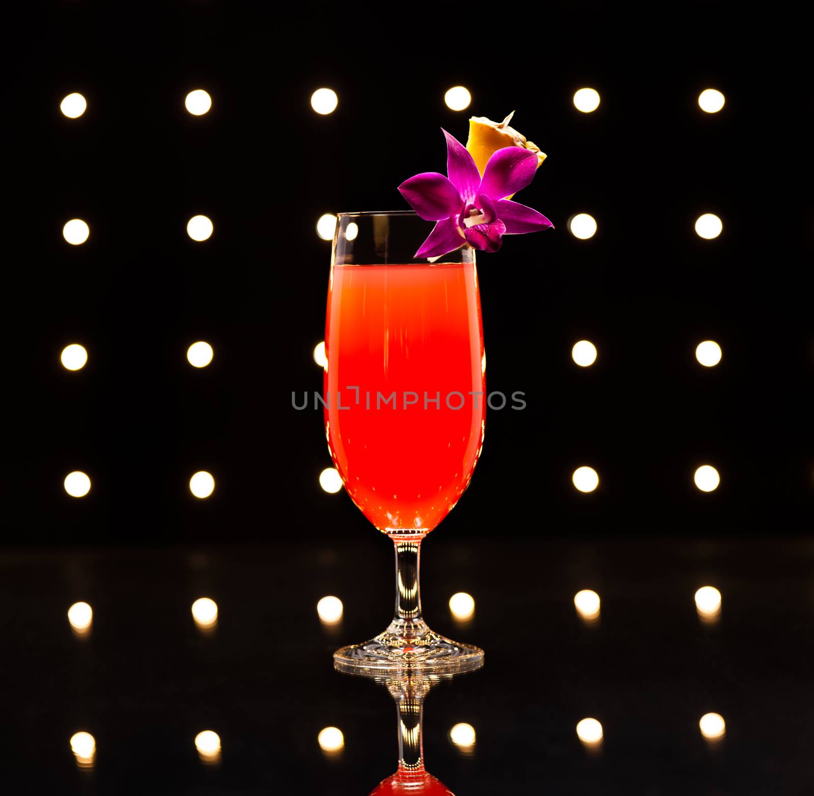 Singapore Sling developed by Ngiam Tong Boon for the Raffles Hotel in Singapore in the early 1900's. The Singapore Sling is a smooth, slow, sweet cocktail with a complex flavor.