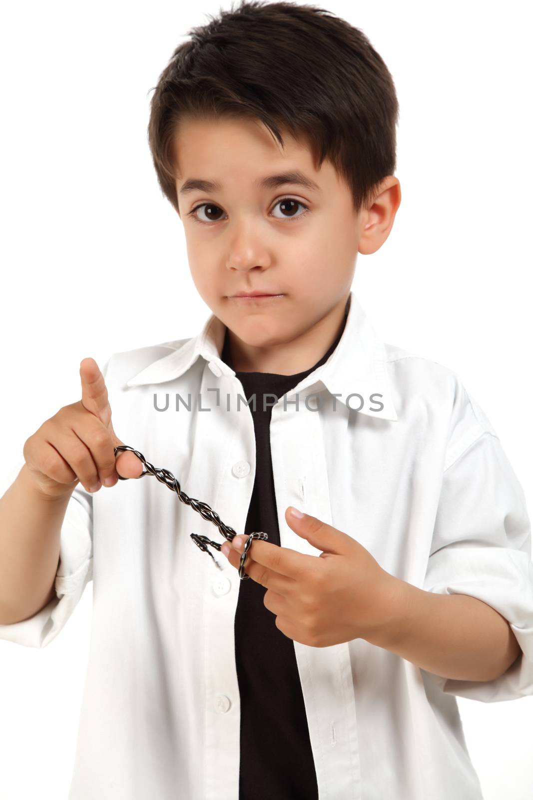 male child playing with rosary for pray