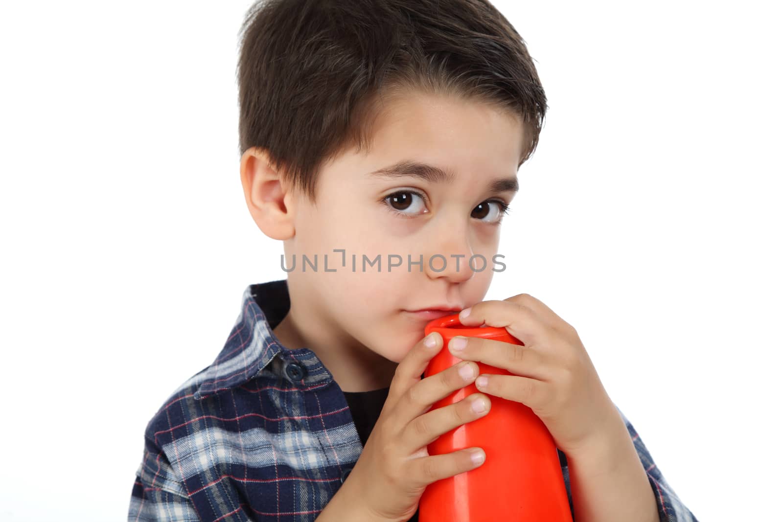 Young boy in studio with safety road signal