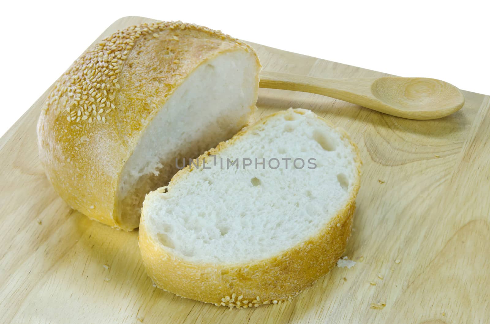 slices of  bread with sesame seeds on wooden board