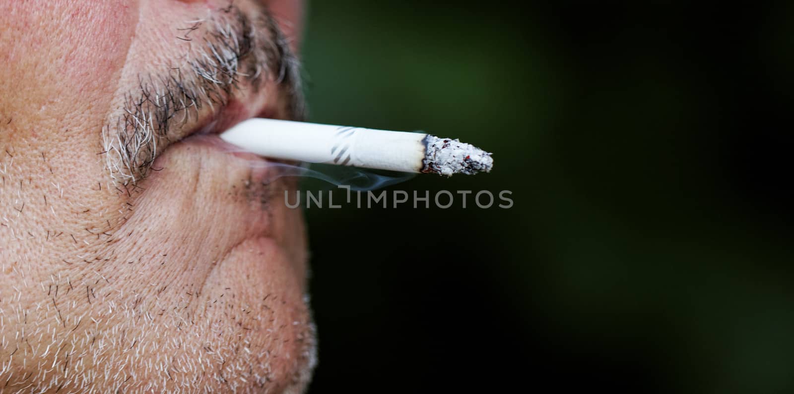 Man smoking a cigarette by NagyDodo