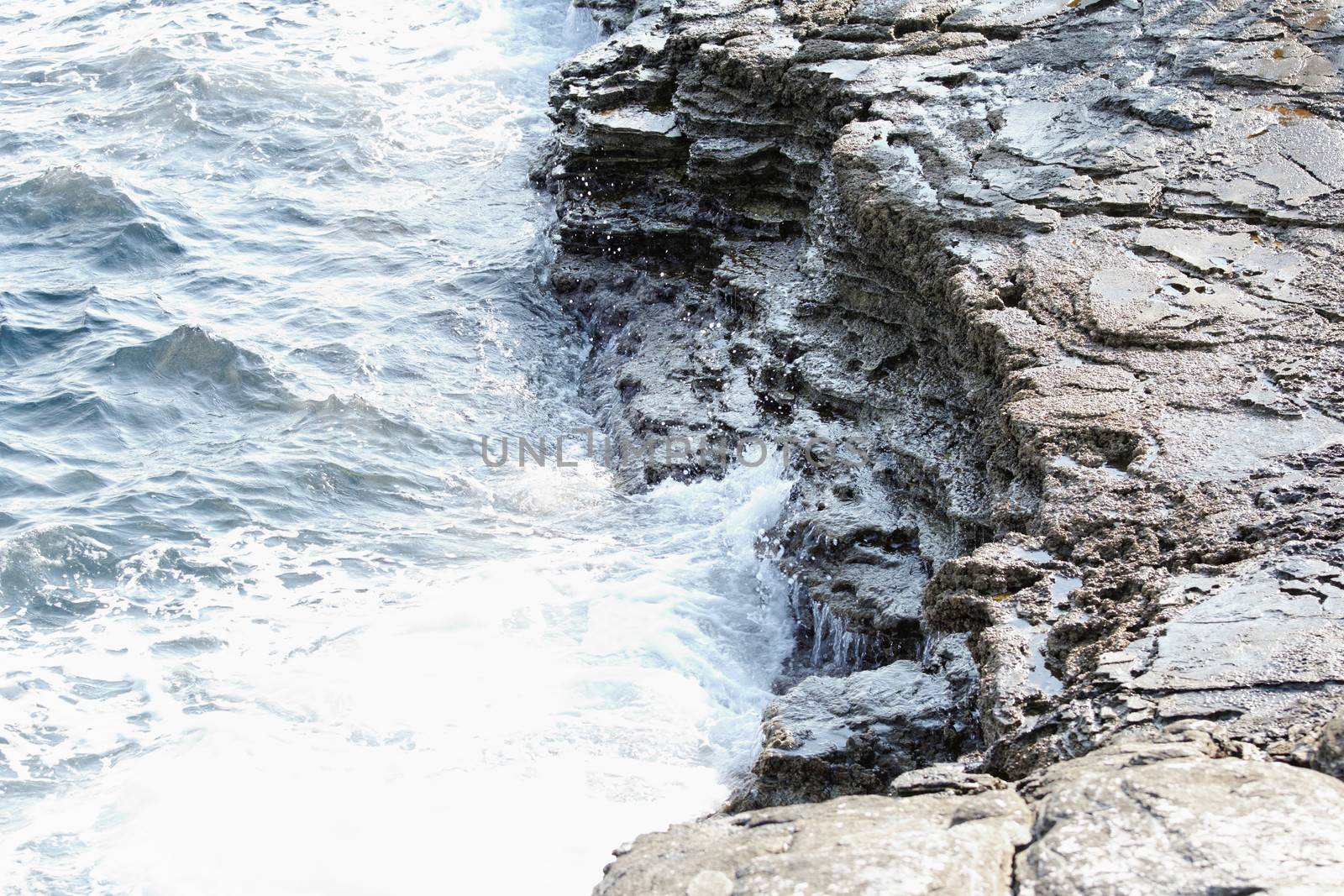 the rocky beach breaks the huge waves