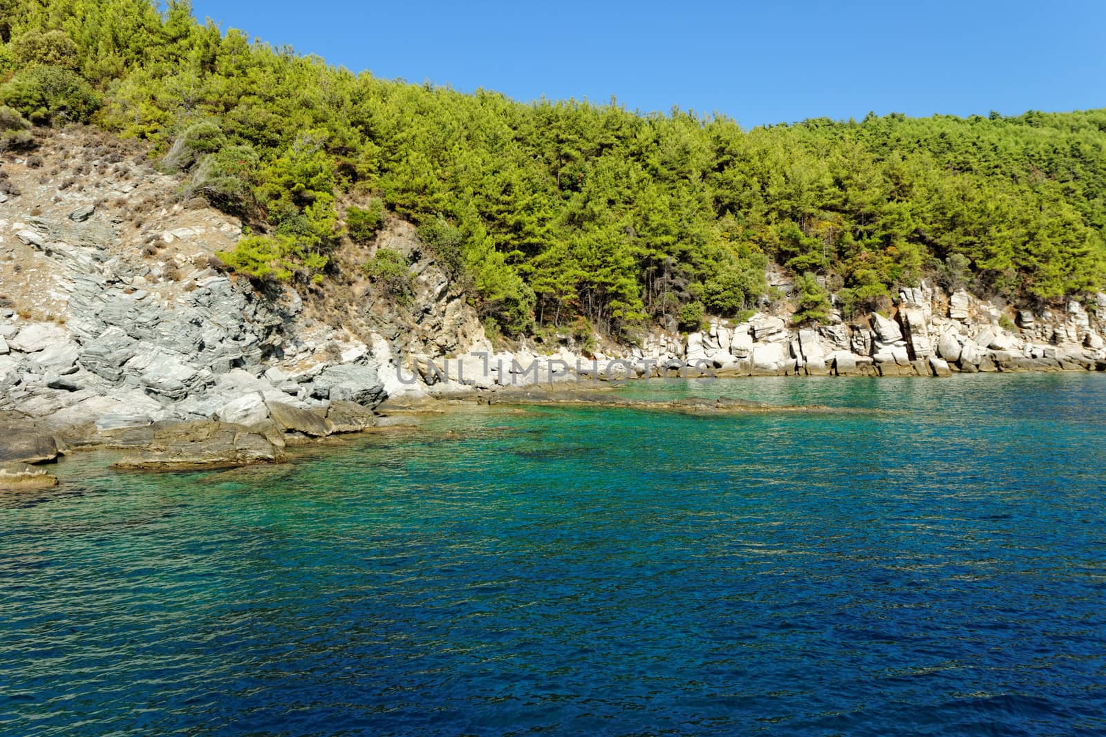 rocky beach with turquoise sea in greece thassos island