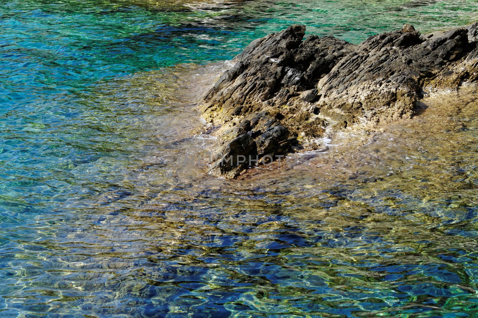 rocky beach with turquoise sea in greece thassos island