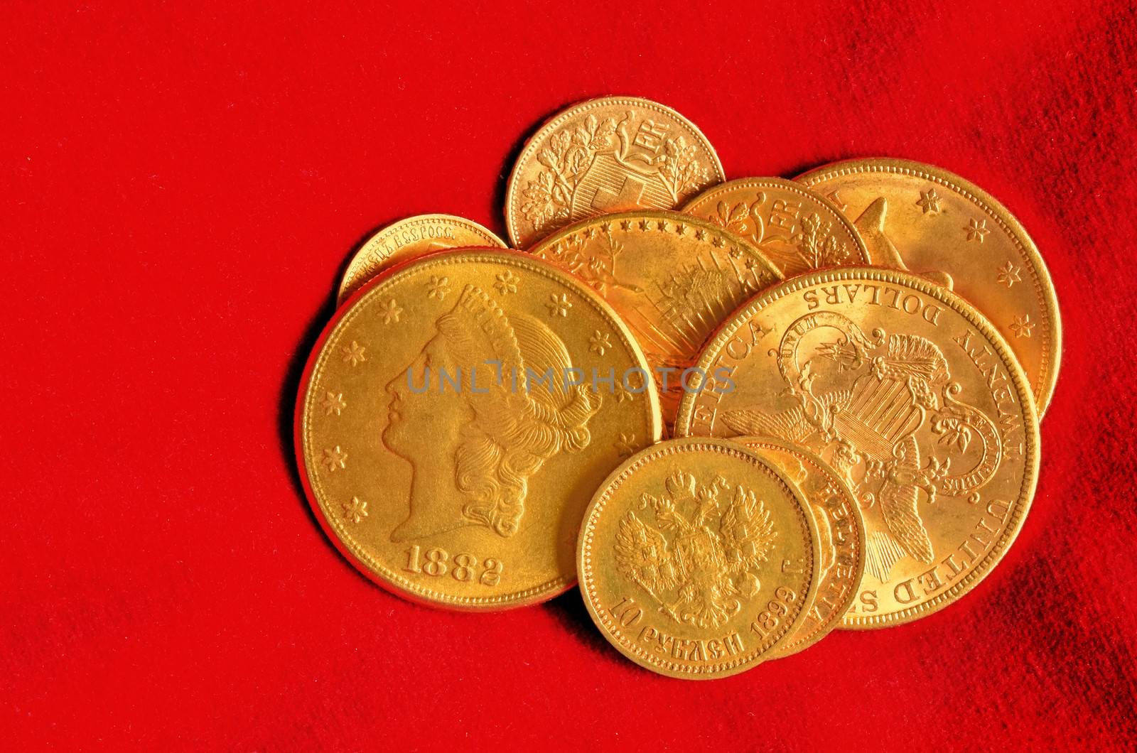 Golden coins from the end of nineteenth century. Rubels, dollars, swiss and french francs.