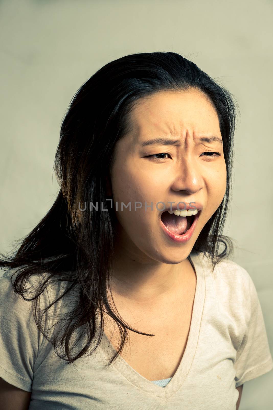 Young woman shouting, with fashion tone and background