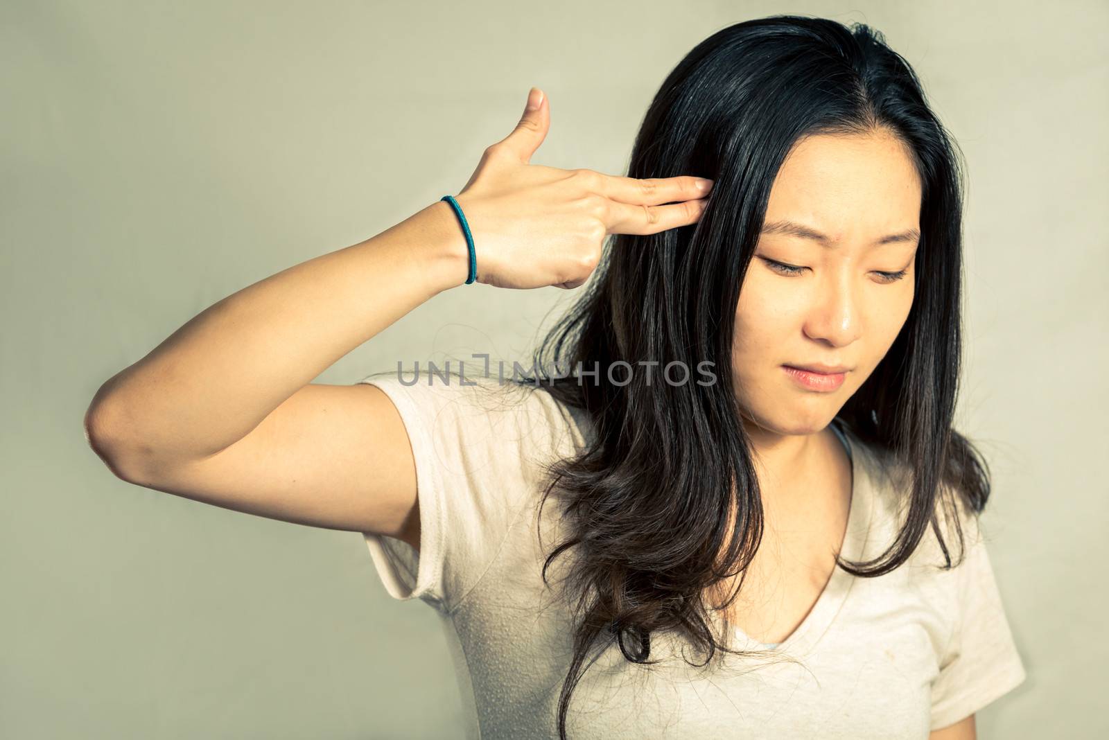 Young woman looking depressed by IVYPHOTOS