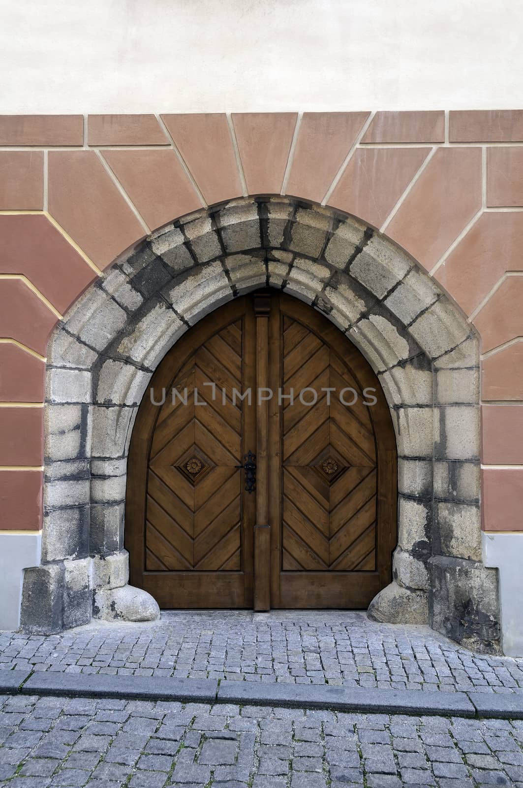 Gothic style, wooden door in european medieval town.