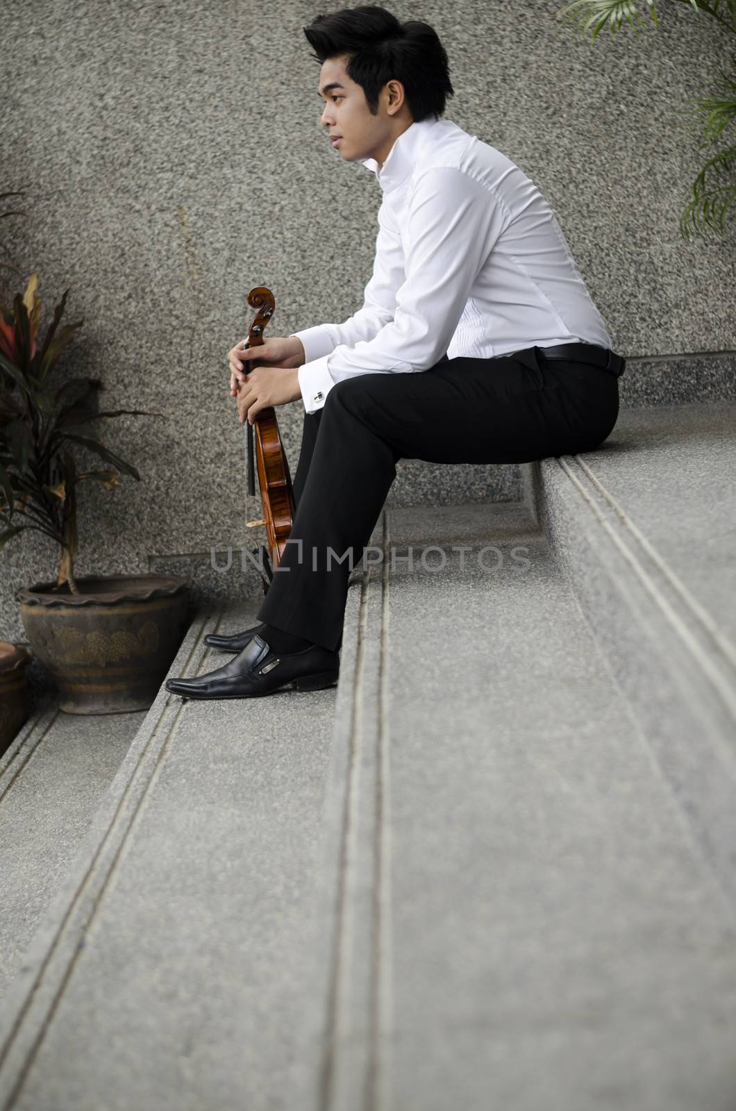 Thailand asia man with his violin he is a soloist