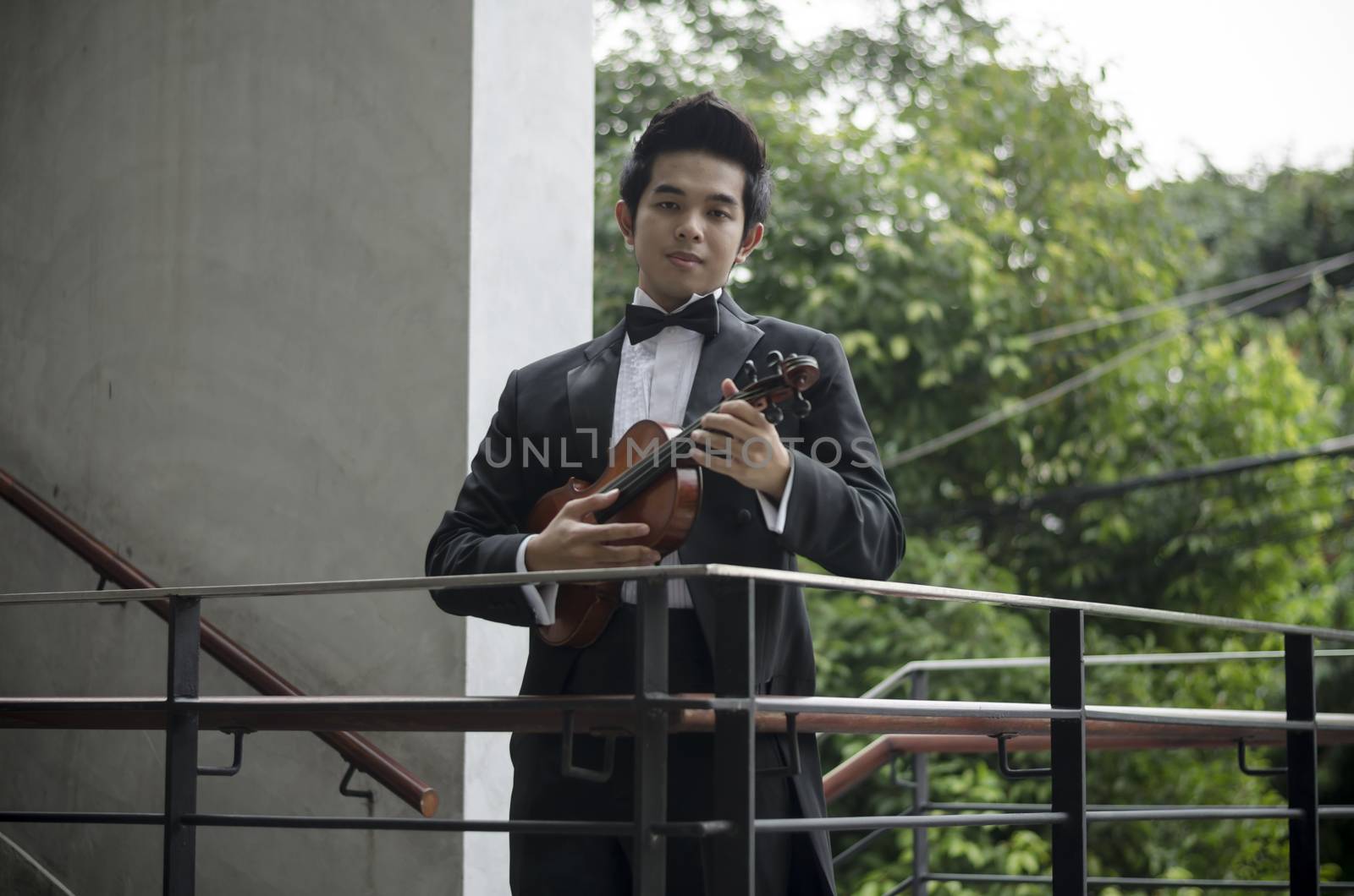 Thailand asia man with his violin he is a soloist