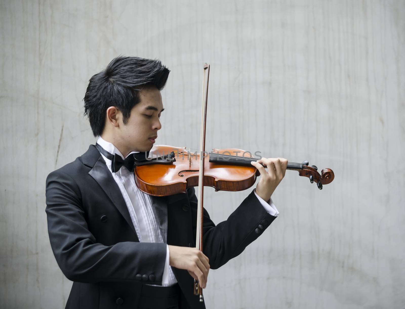 Thailand asia man with his violin he is a soloist