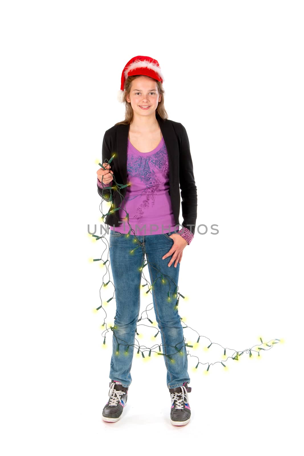 a girl wrapped in christmas lights on a white background