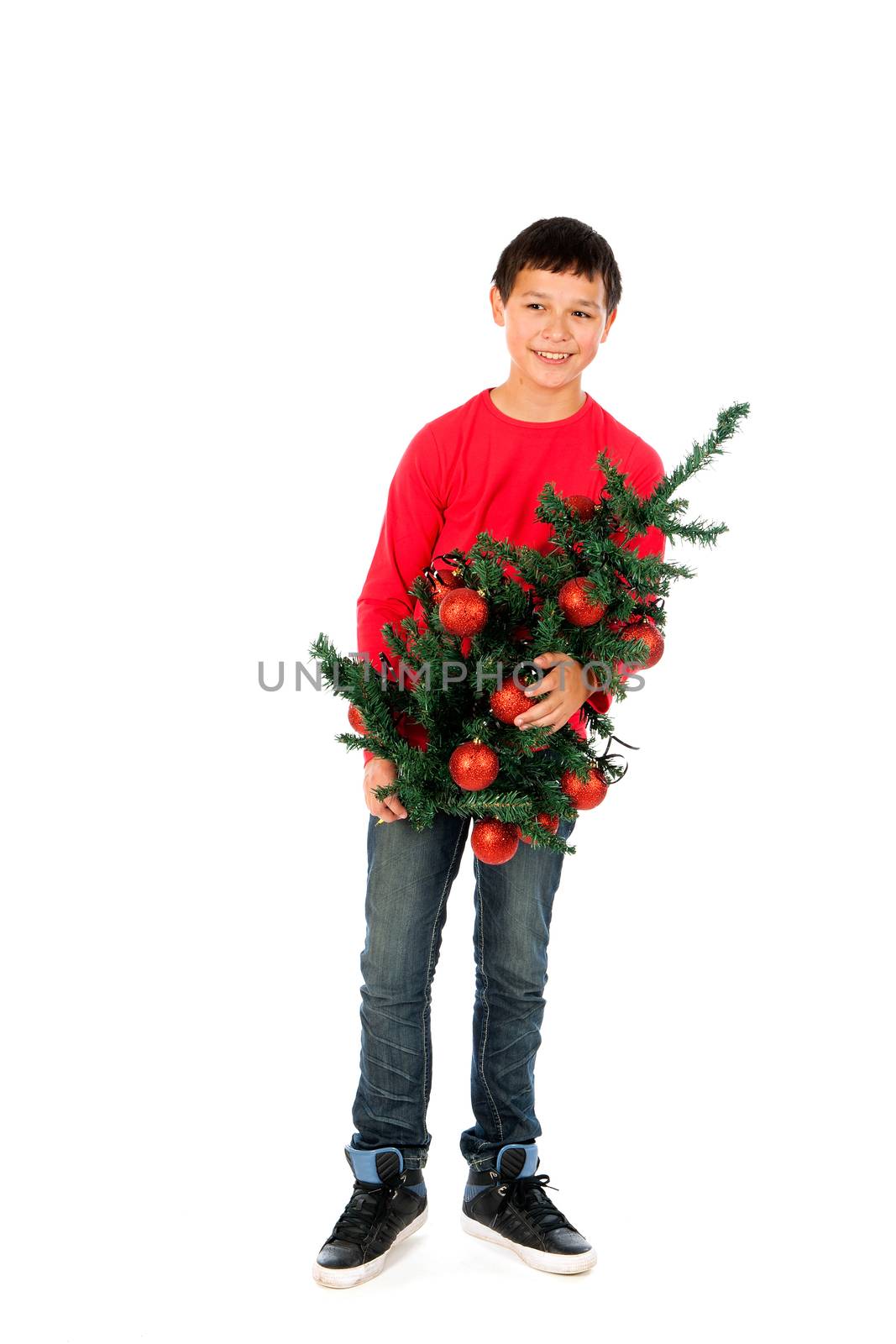 a boy with a Christmas Tree on a white background