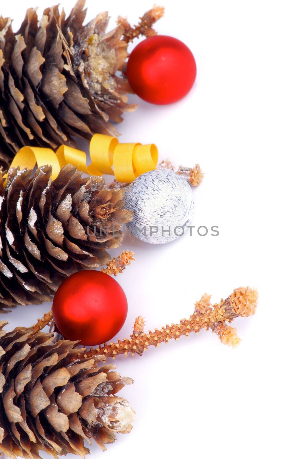 Frame of Fir Cones, Spruce Stems, Silver and Red Baubles isolated on white background